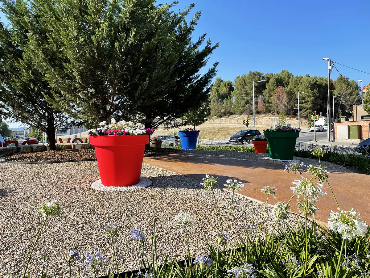 Colorful flower pots in a roundabout