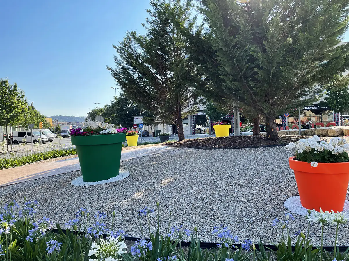Colorful flower pots in a roundabout